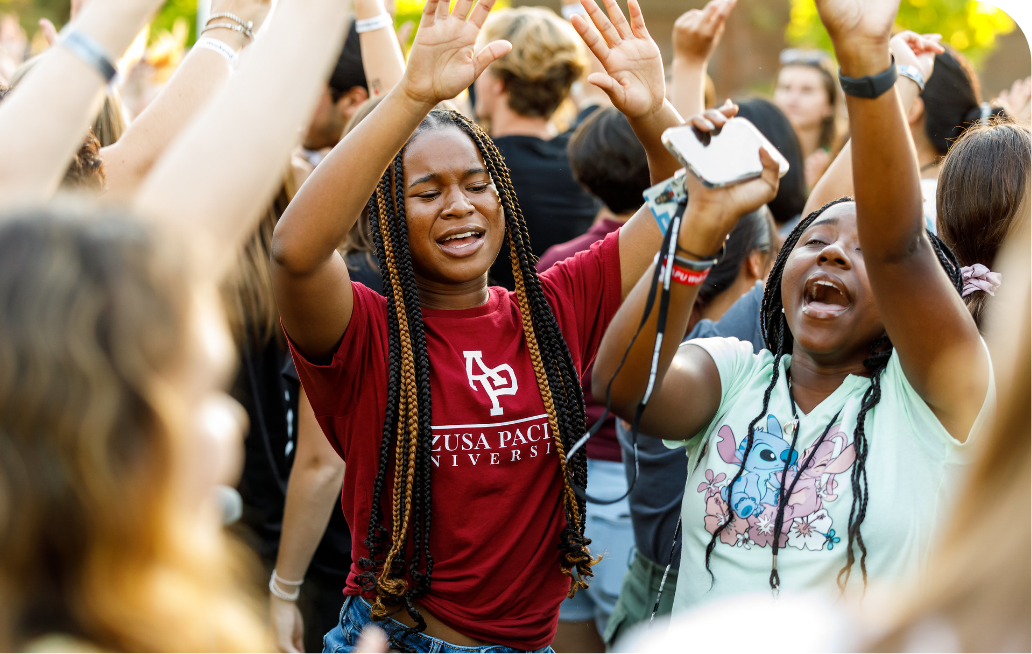 Students cheering among the crowd